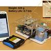 Smartphone controlled handheld microfluidic liquid handling system. Inset: A multi-layer PDMS device with on-chip elastomeric valves. Smartphone controlled handheld microfluidic liquid handling system. Inset: A multi-layer PDMS device with on-chip elastomeric valves.