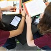 Students using personal computing devices to work in collaboration; http://www.imlc.io/