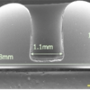 Cross-sectional SEM of a microstructure shell produced in a reflow molding process. This structure is suitable for use as a resonator in a vibratory gyroscope.
